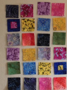 Fabric squares on design wall.