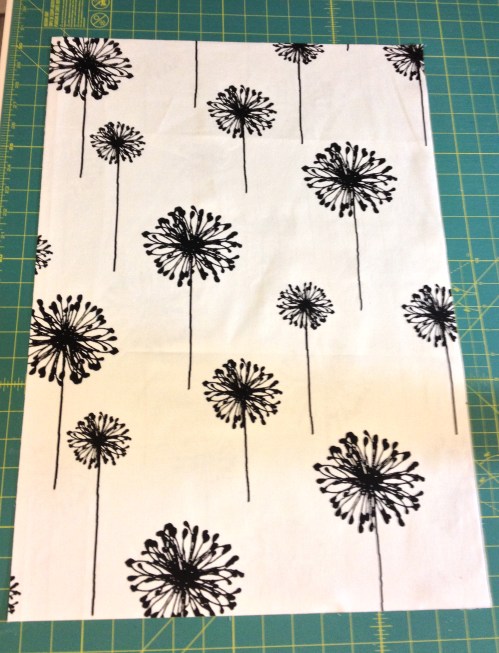 Design on fabric should face this way.