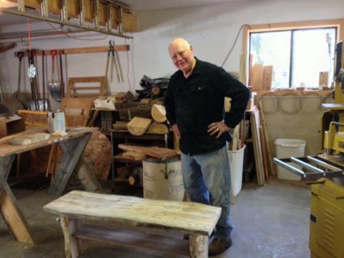 This is JB with a bench that he made the week before which will be sold in a local gallery when he finishes it.
