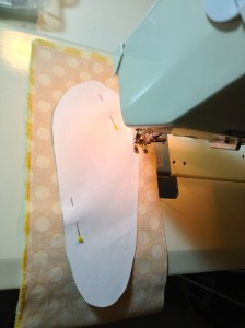 With right sides together, I sewed all the way around the paper pattern.