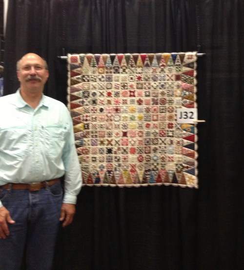 Jim shows how small this quilt is.
