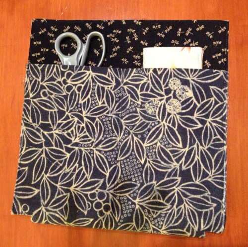 The outside back has a divided pocket.