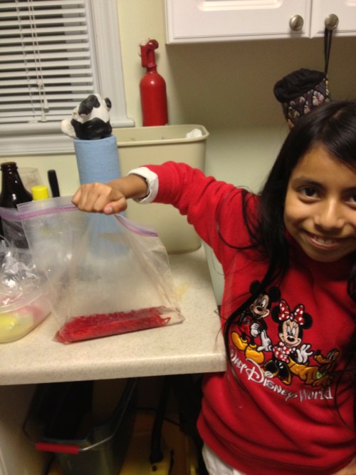 Maya showing cooled bag before removing the dyed yarn.